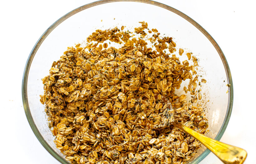 Oats mixed with additional ingredients to make granola. 