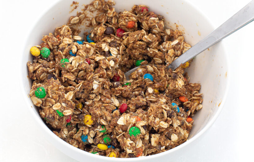 Energy bite mixture after being mixed in a white mixing bowl.