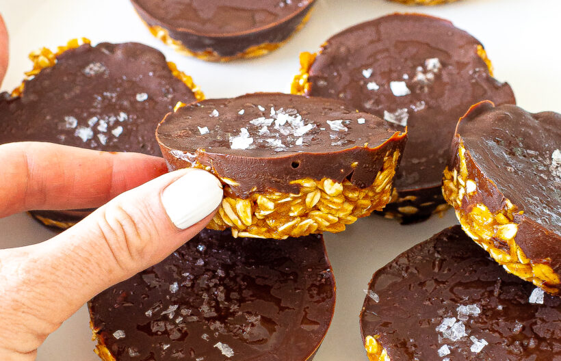 Hand holding a no bake pumpkin oat cup.