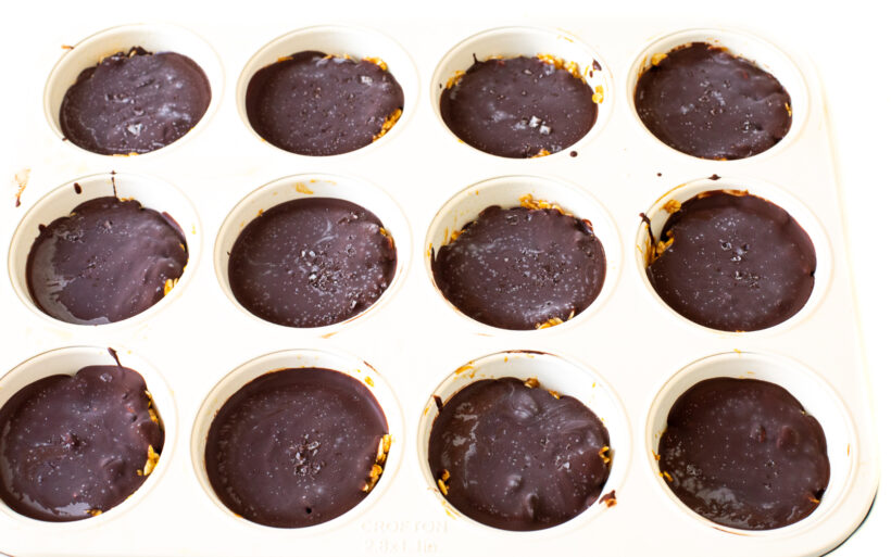 Frozen oat cups in a muffin tin.