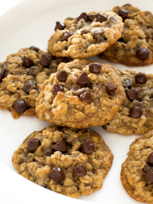 a white plate filled with these homemade oatmeal chocolate chip cookies