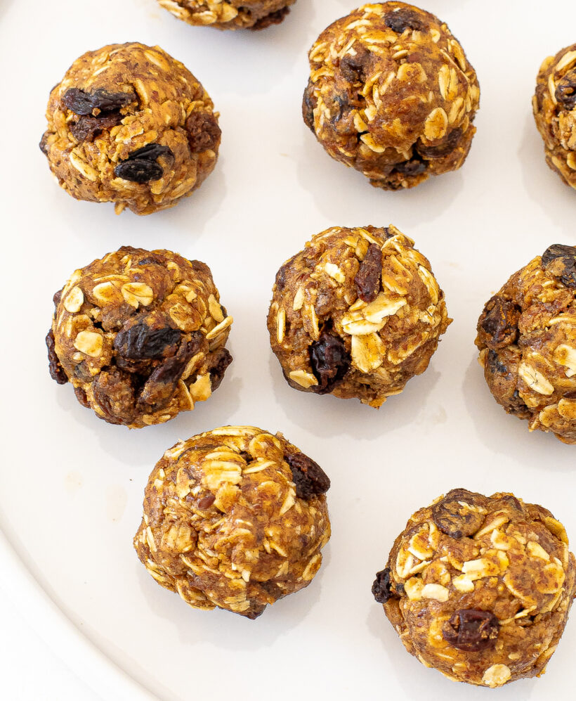 Oatmeal raisin energy bites served on a white plate. 