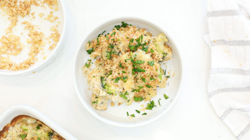 overhead shot of a portion of broccoli quinoa casserole on small plate