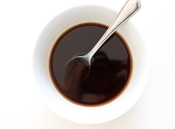 pad thai sauce in white bowl with spoon.