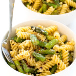 close up of this Lemon Asparagus Pasta in white bowls with a fork | chefsavvy.com