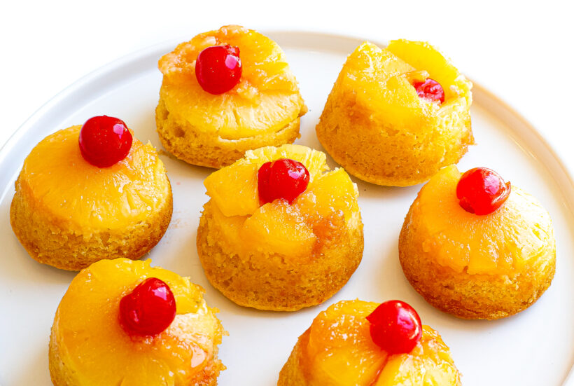 Pineapple cakes inverted onto a plate after being baked.