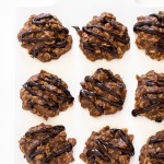 Top shot of no bake chocolate cookies in rows on white cutting board.