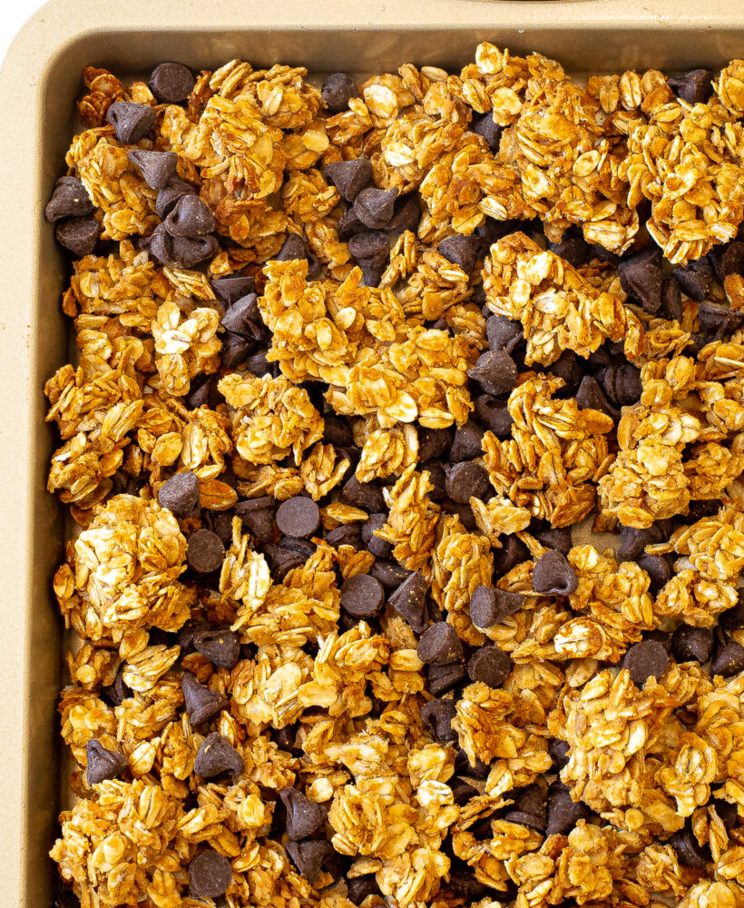 peanut butter chocolate chip granola on baking sheet