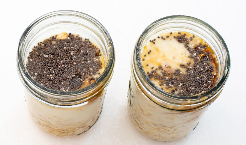Assembling the overnight oats in two glass jars.