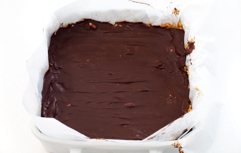 Healthier scotcheroos in a baking dish after being frozen. 