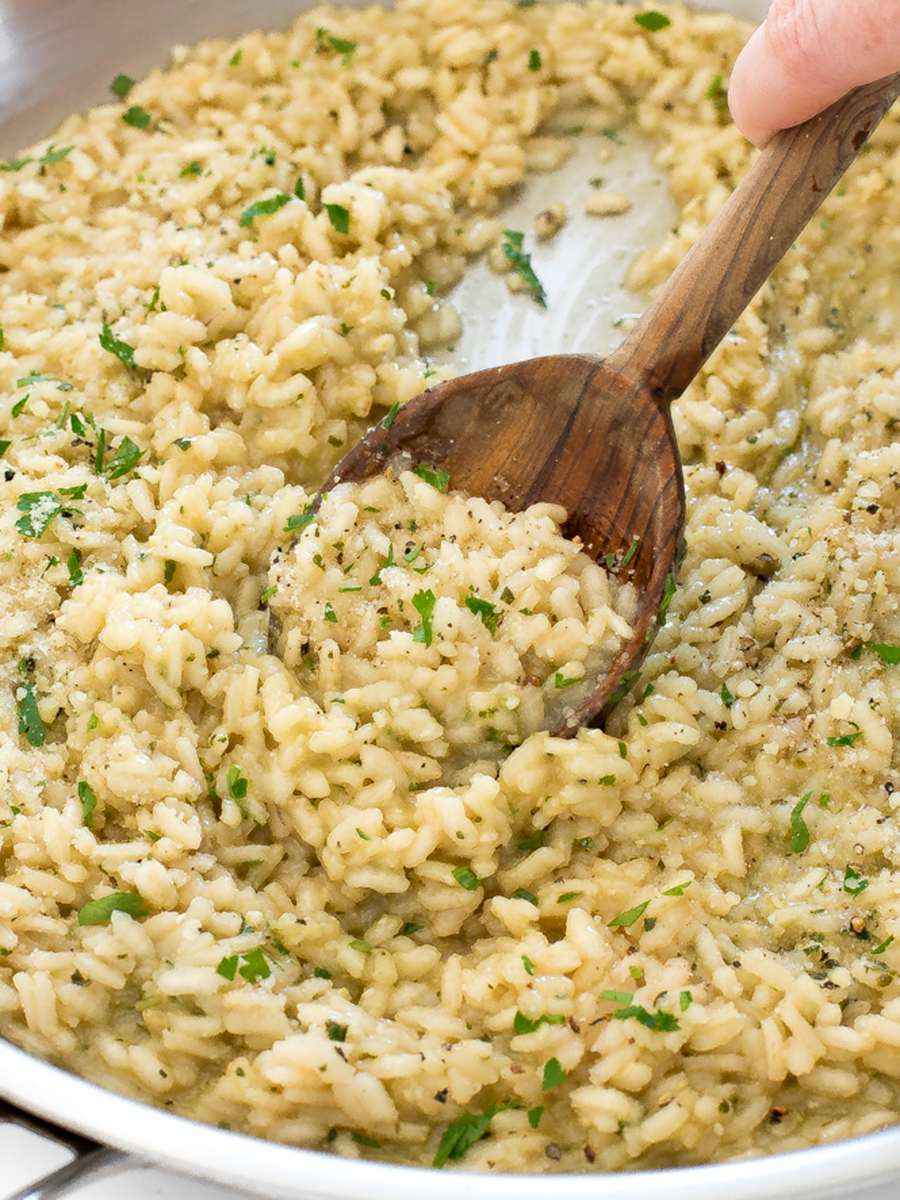 Creamy Pesto Risotto in skillet with wooden spoon
