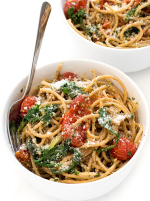 one white bowl full of pesto pasta