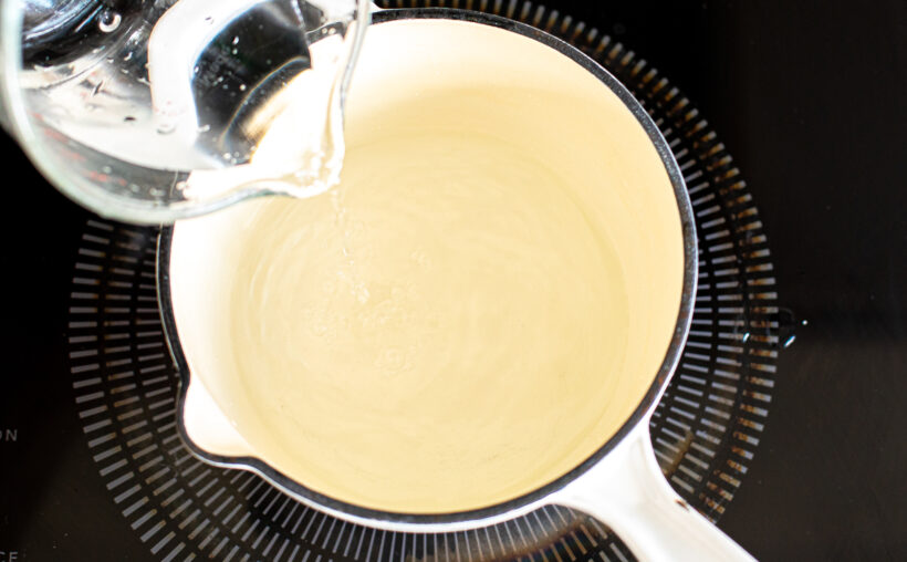 pouring brining liquid in medium saucepan