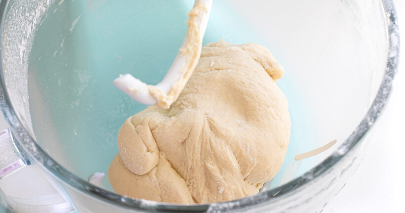 dough ball in glass stand mixer bowl