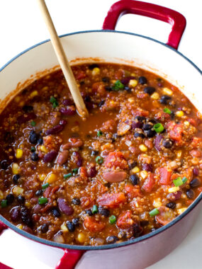 This healthy and delicious Vegetarian Quinoa Chili features three types of beans, corn, and quinoa. It's hearty, filling, and full of flavor!