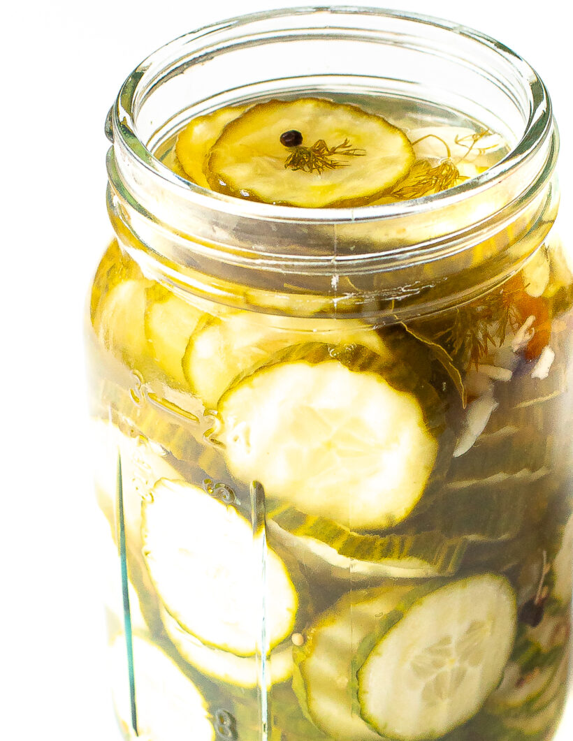 Pickle slices in a jar with brine.