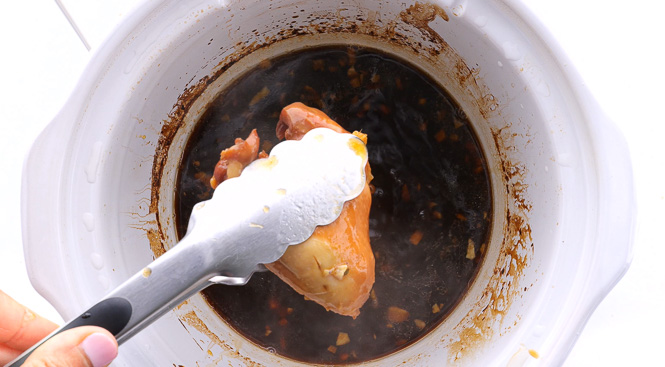 removing slow cooked teriyaki chicken thighs from slow cooker