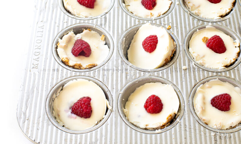 White chocolate oat cups after they have been chilled and still in the muffin tin.