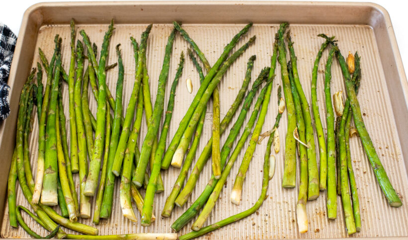 roasted asparagus on baking sheet