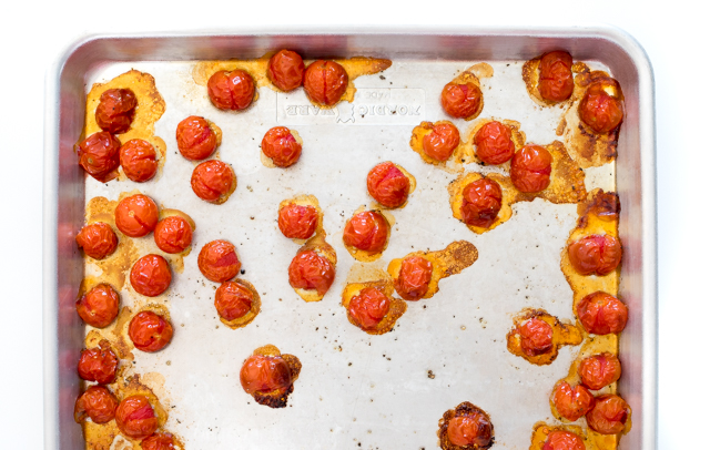 Cherry tomatoes on a baking sheet.