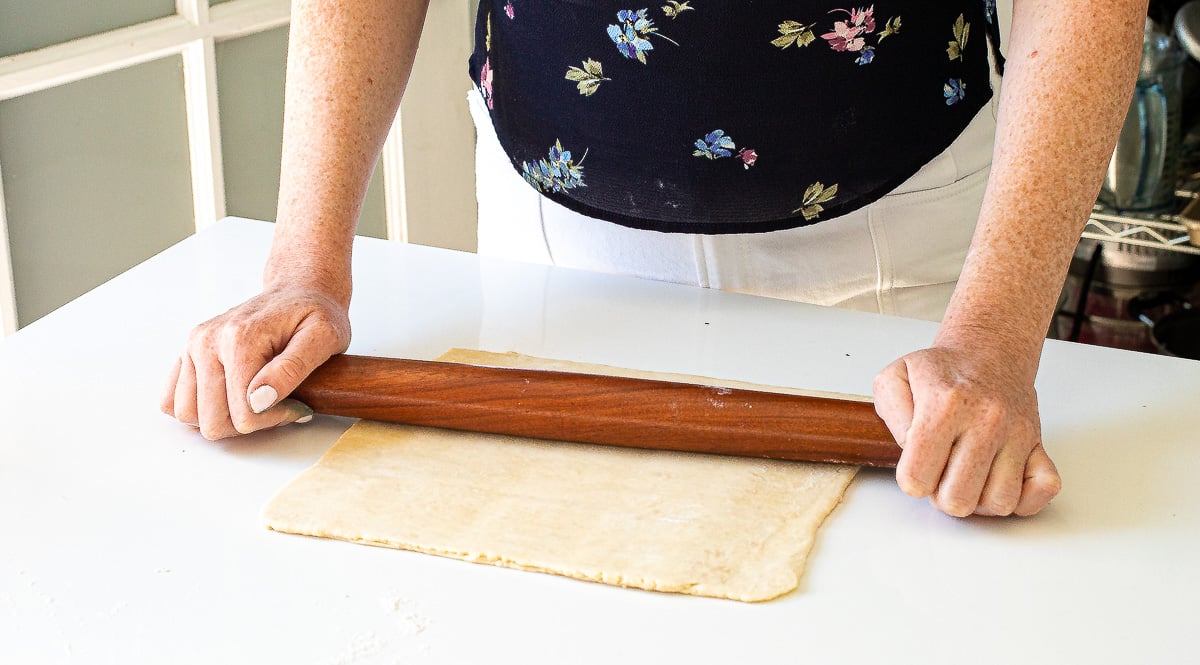 rolling out puff pastry dough