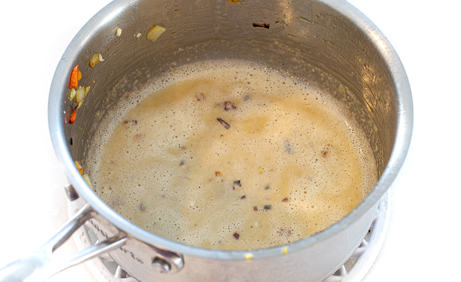 Chicken pot pie gravy in a saucepan. 