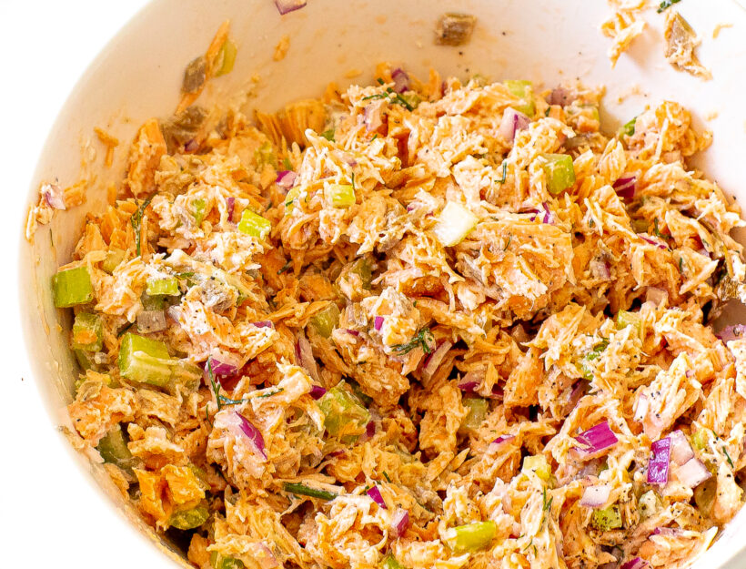 Salmon salad in a white bowl. 