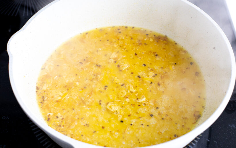 Pasta sauce simmering on the stove.
