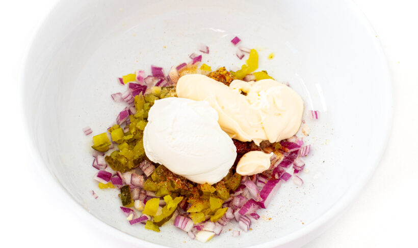 Dressing ingredients in a white mixing bowl.