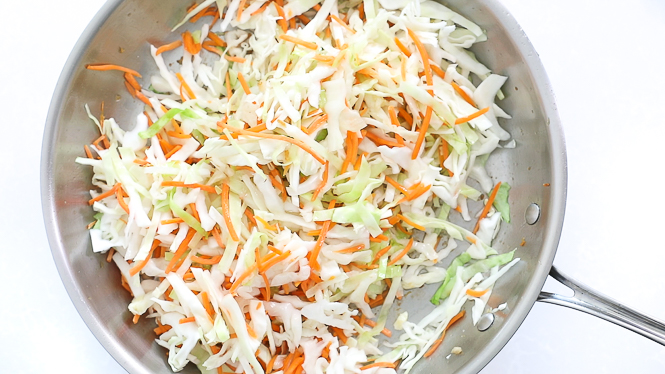 sautéed cabbage and carrots in large skillet
