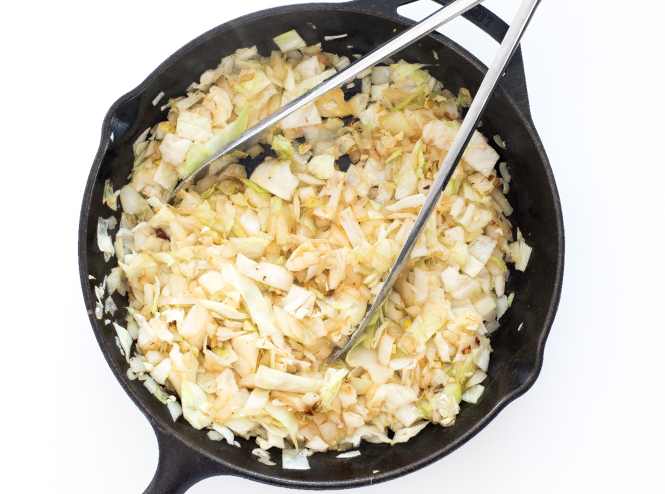 sauteed cabbage and onion in cast iron skillet