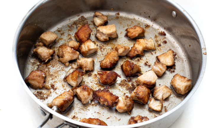 browning chicken bites in large silver skillet