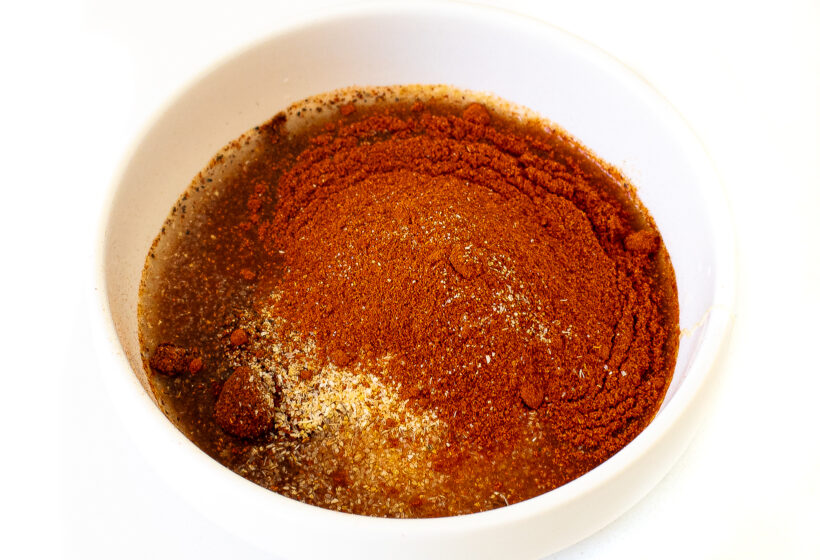 adding spices. honey and apple cider vinegar to bowl