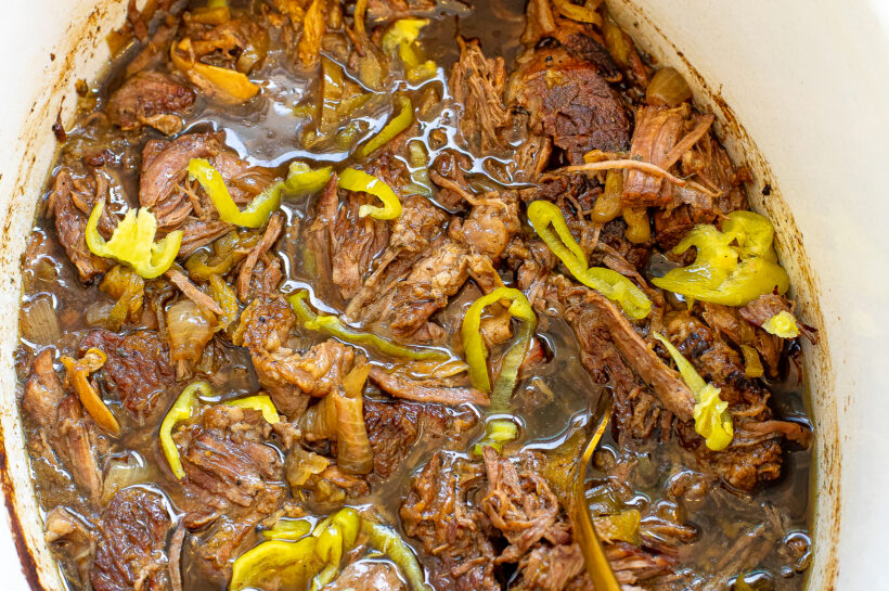 Shredded italian beef in a slow cooker.