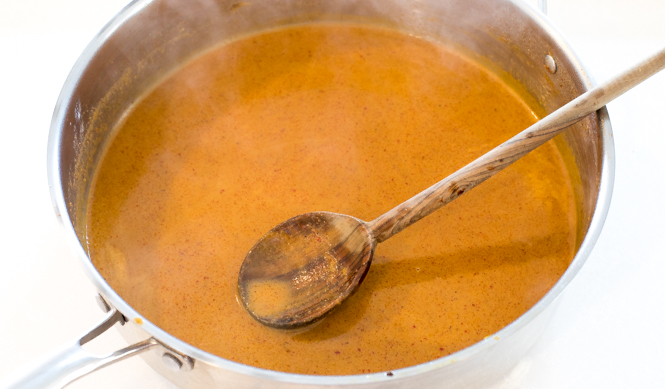 simmering coconut milk and curry paste