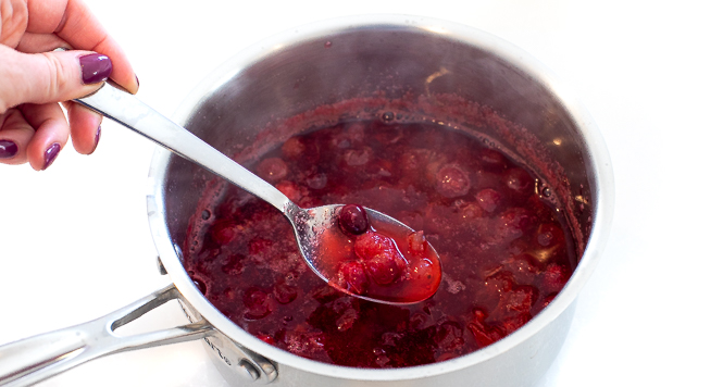 simmering fresh cranberries and water in a small saucepan