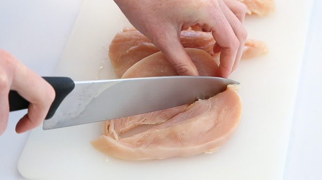 slicing chicken breast in half