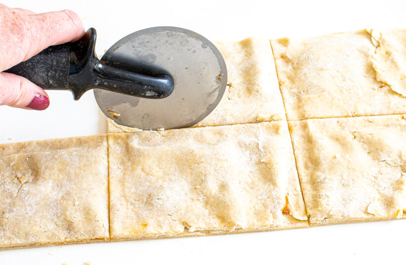 Pizza cutter cutting pop tarts.