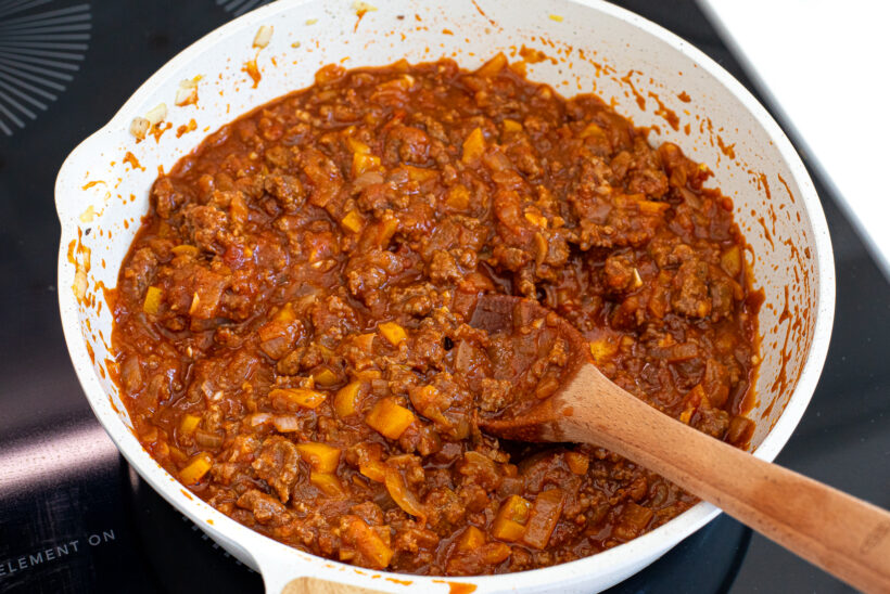Sloppy joe beef mixture in a skillet after being simmered. 