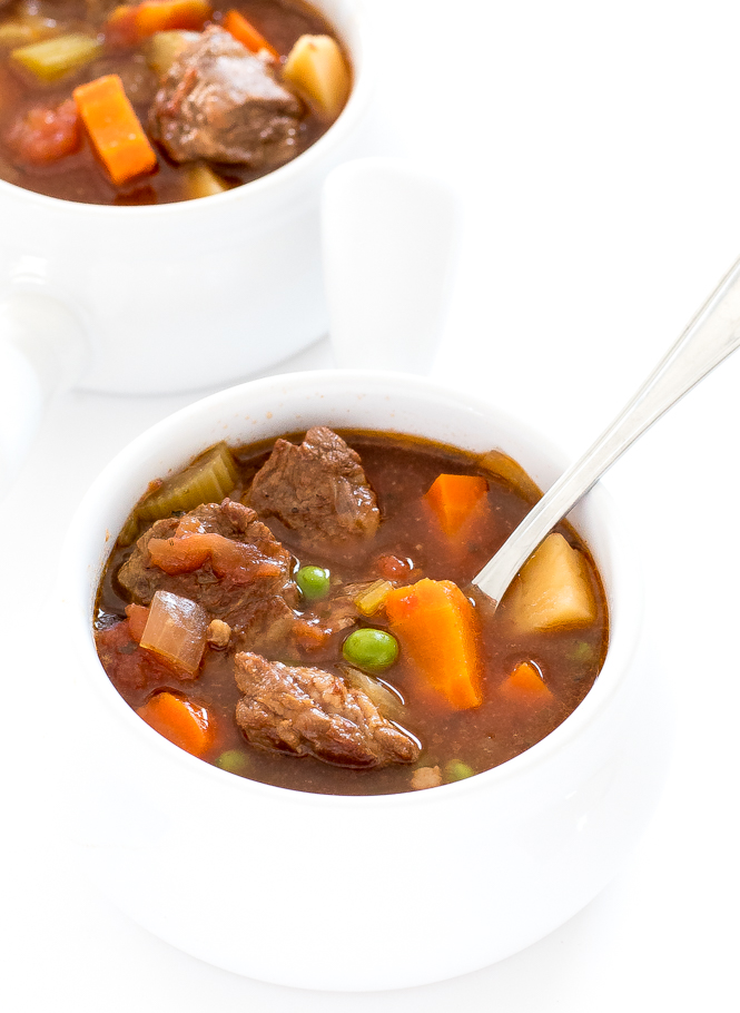 Crockpot Vegetable Beef Soup in white bowls with a spoon 
