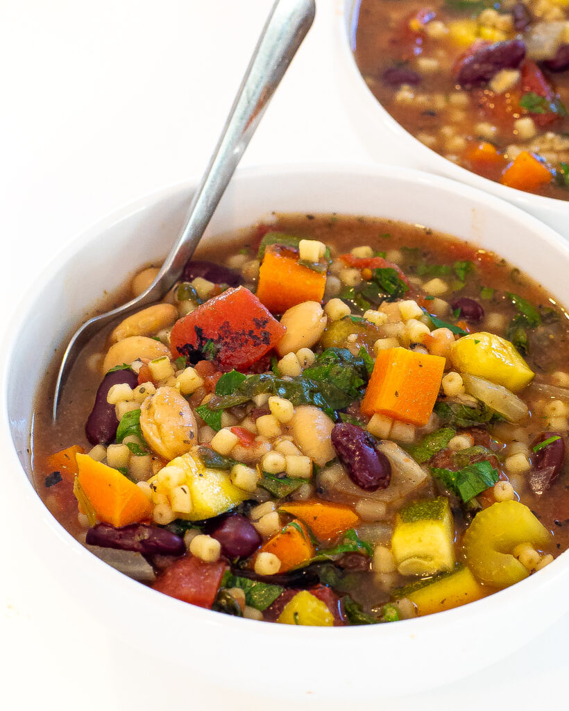 bowl of minestrone soup with spoon