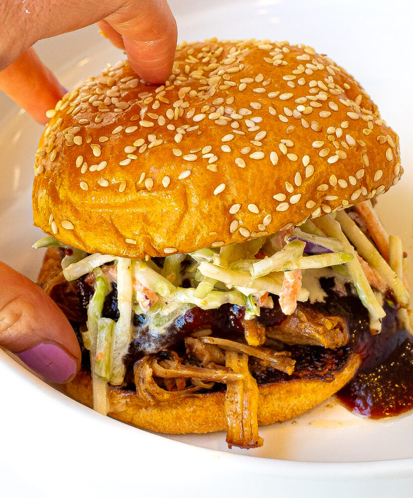 pulled pork sandwich with coleslaw, shredded pork, barbecue sauce