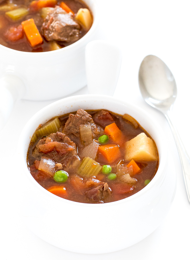 Crockpot Vegetable Beef Soup in white bowls with a spoon 