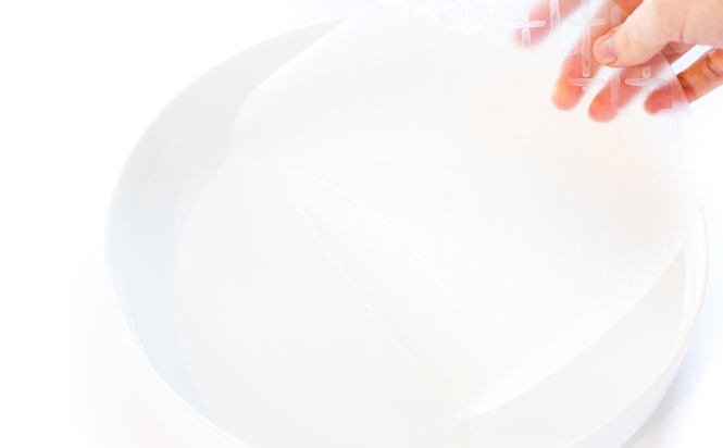 soaking spring roll wrapper in warm water