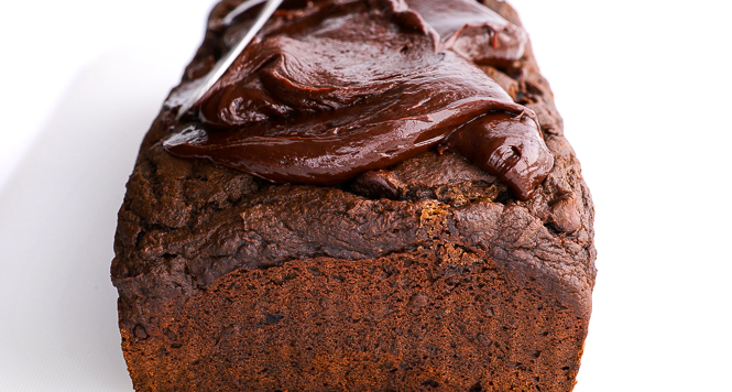 spreading ganache on to pumpkin bread