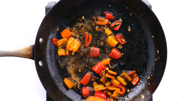 adding sauce ingredients to skillet