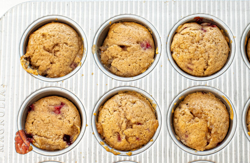 Strawberry upside down cakes in muffin tin after being baked. 