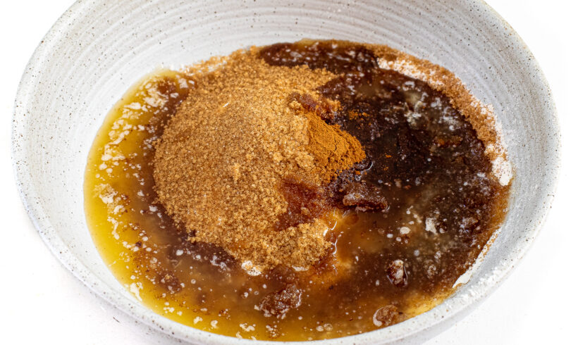 Streusel ingredients in a white speckled bowl.