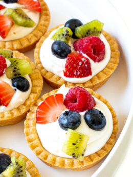 These Mini Fruit Tarts are the perfect individual-sized dessert for spring and summer! Each tart is made with a buttery crust and filled with mascarpone cream, then topped with fresh fruit. They’re as pretty as they are delicious!