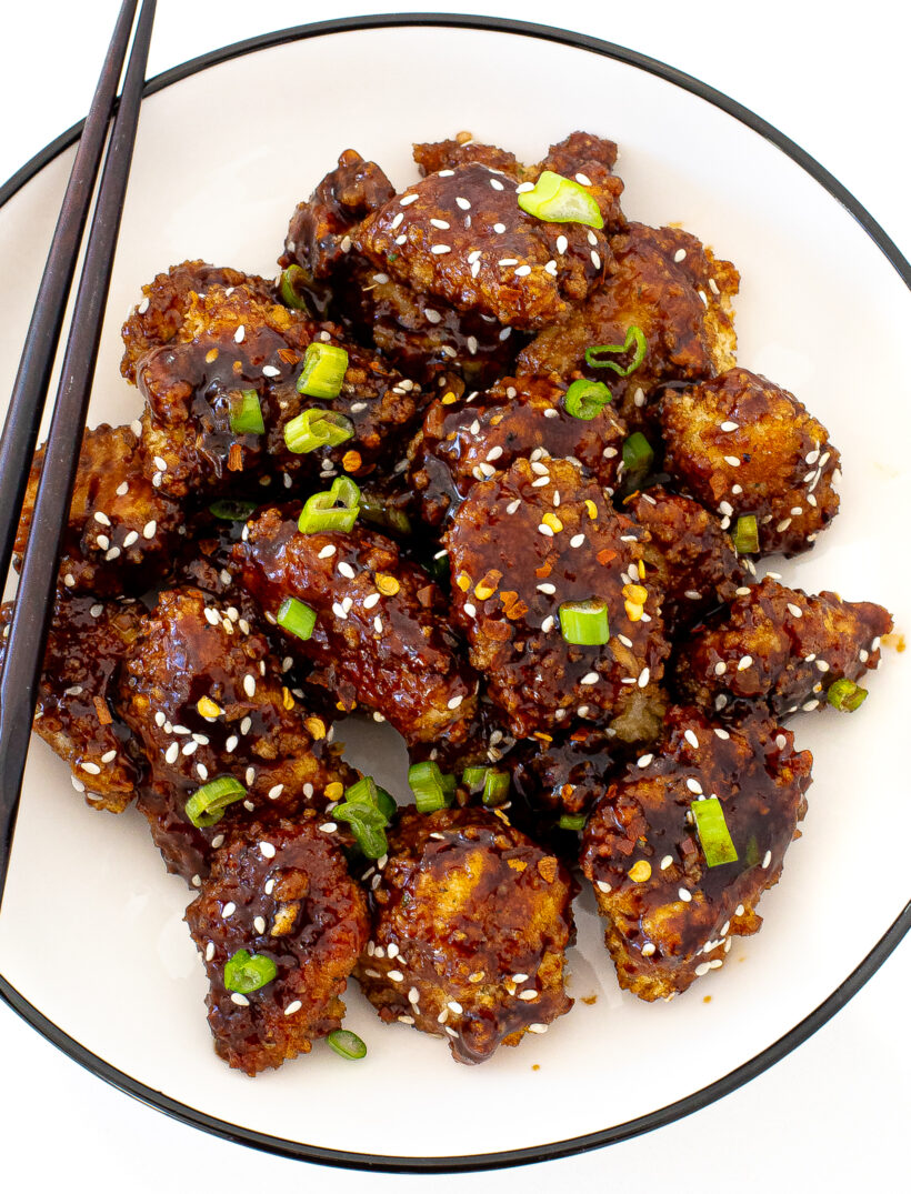 breaded chicken pieces in a sweet and spicy honey sriracha sauce